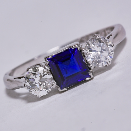 55 - SAPPHIRE AND DIAMOND 3-STONE RING,
18 ct. gold and platinum.
Size J.