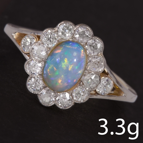 59 - OPAL AND DIAMOND CLUSTER RING,
3.3 grams, high carat gold.
Vibrant opal with good play of colour.
Si... 