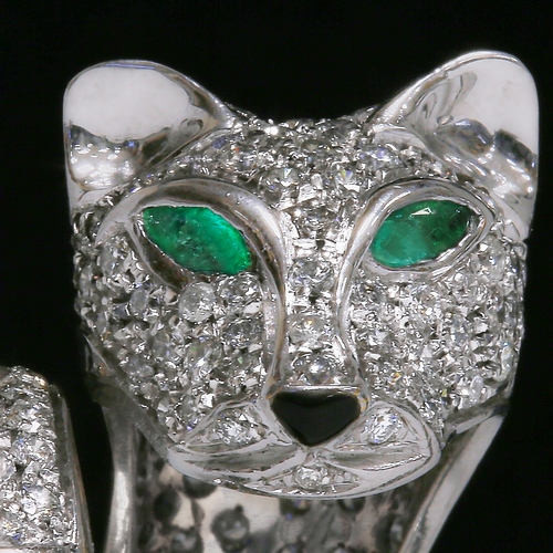 26 - DIAMOND AND EMERALD PANTHER RING.
15 grams, 18 ct. gold.
Diamonds bright and lively, totalling appro... 