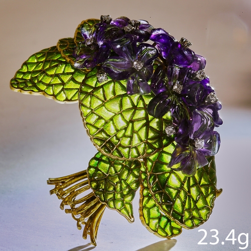 151 - CARVED AMETHYST, DIAMOND AND PLIQUE-A-JOUR FLORAL BROOCH,
23.4 grams, 18 ct. gold.
The flower head c... 