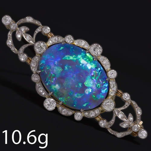 155 - BELLE EPOQUE LARGE OPAL AND DIAMOND BROOCH,
10.6 grams.
Large and vibrant opal with good play of col... 