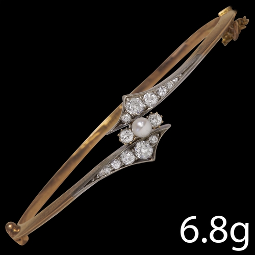 18 - EDWARDIAN PEARL AND DIAMOND GOLD HINGED BANGLE,
6.8 grams.
Inner diam. 5.7 cm.
FITTED CASE