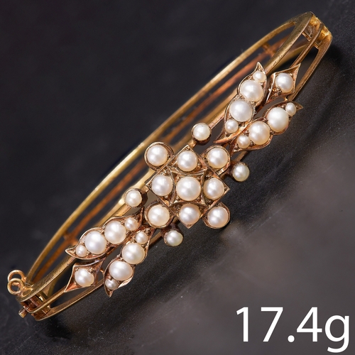 181 - EDWARDIAN PEARL HINGED BANGLE. 
17.4 grams, High carat gold.
Pearls well matched (untested, presumed... 