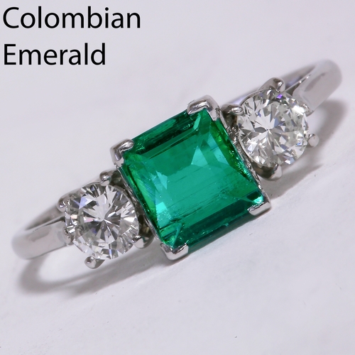 11 - COLOMBIAN EMERALD AND DIAMOND 3-STONE RING, 
2.6 grams, testing 18 ct. gold.
The vibrant emerald of ... 