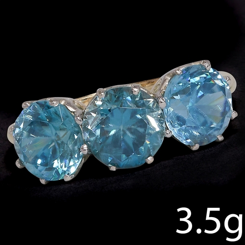 186 - BLUE ZIRCON 3-STONE RING, 
3.5 grams, High carat gold.
Vibrant blue zircons, totalling approx. 6.25 ... 