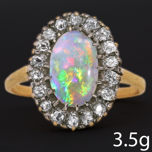 44 - OPAL AND DIAMOND CLUSTER RING,
3,5 grams, high carat gold.
Vibrant opal with good play of colour, in... 