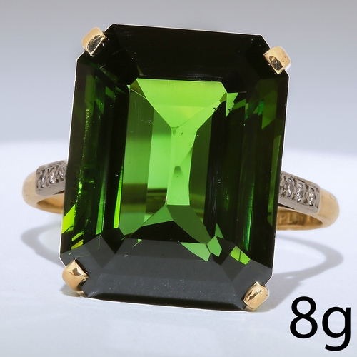 58 - GREEN TOURMALINE AND DIAMOND RING,
8 grams, 18 ct. gold and platinum.
Large vibrant green tourmaline... 