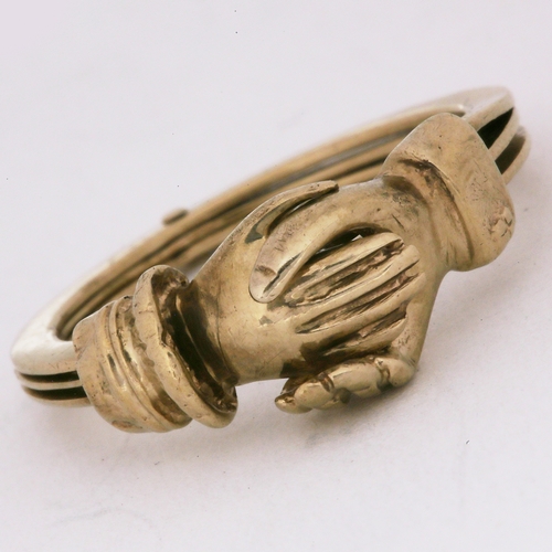 82 - FEDDE GIMMEL HAND RING,
3.3 grams.
The clasping hands covering a heart underneath.
Size L.