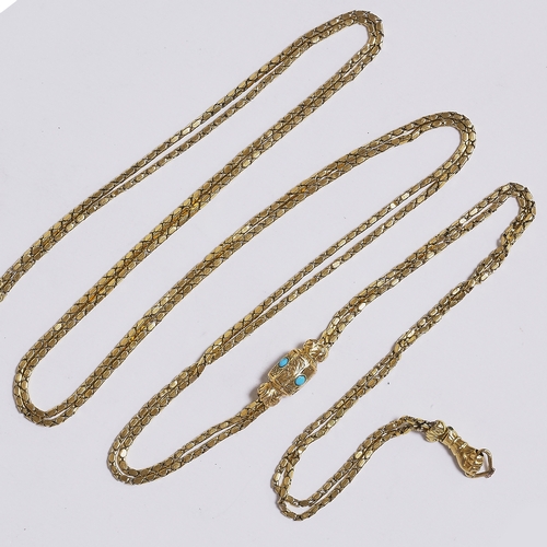 25 - ANTIQUE LONG GUARD CHAIN WITH TURQUOISE SLIDER.
18.5 grams, French 18 ct. gold.
The end of the neckl... 