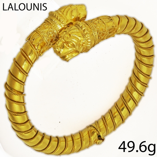 67 - ILIAS LALAOUNIS, DOUBLE HEADED LION BANGLE,
49.6 grams, 18 ct. gold.
The bangle of torque design wit... 