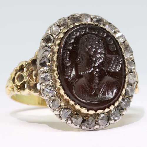 102 - ANTIQUE INTAGLIO DIAMOND CLUSTER RING,
5,5 grams, testing high carat gold and silver.
The carved int... 