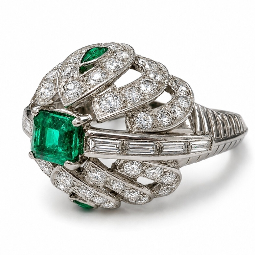 105 - EMERALD AND DIAMOND CLUSTER RING,
8.9 grams, testing high carat gold.
Rich and vibrant emeralds tota... 