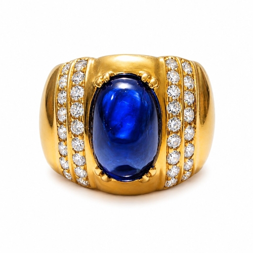 120 - ERIC BERTRAND, SAPPHIRE AND DIAMOND RING,
 9.5 grams, 18 ct. gold.
Rich and vibrant cabochon cut sap... 