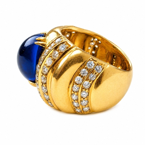 120 - ERIC BERTRAND, SAPPHIRE AND DIAMOND RING,
 9.5 grams, 18 ct. gold.
Rich and vibrant cabochon cut sap... 