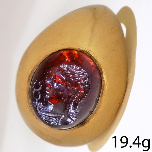 78 - ROMAN CARVED GARNET INTAGLIO RING
19.4 grams, high carat gold.
The carved garnet intaglio presumed t... 