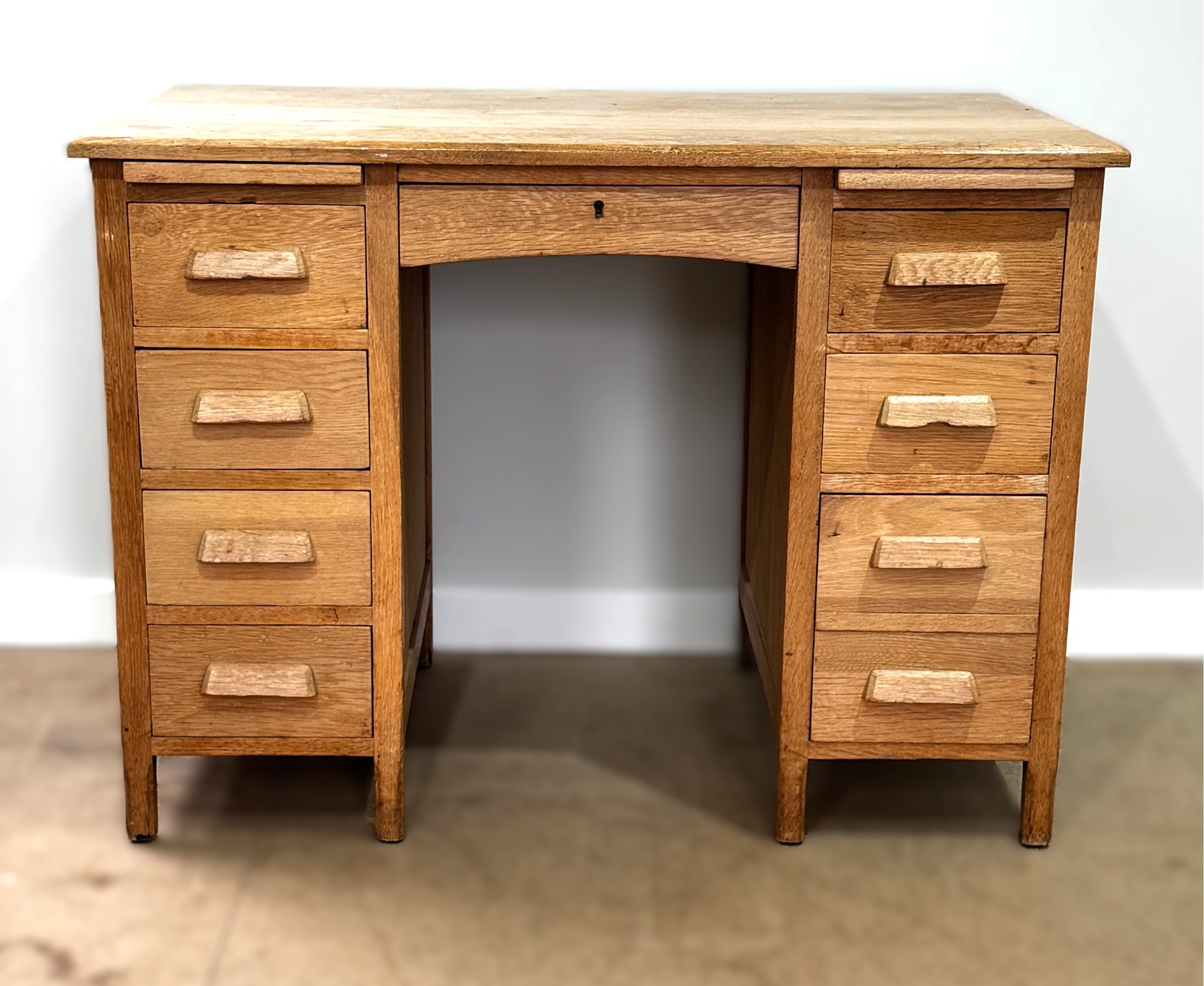 A vintage oak desk, utility type, circa 1930; 78cm high, 107cm width ...