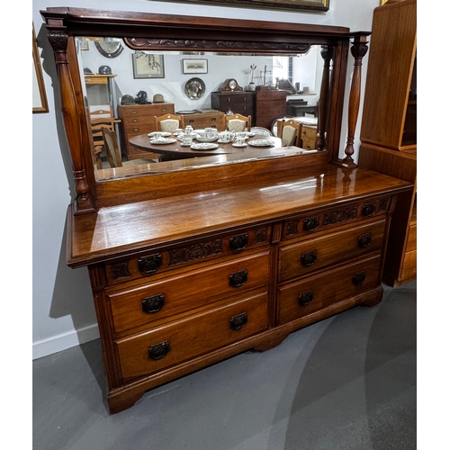 2 - Early 20th century carved walnut dressing chest with mirror back, the rectangular bevelled plate fla... 