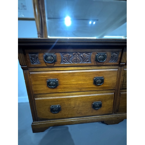 2 - Early 20th century carved walnut dressing chest with mirror back, the rectangular bevelled plate fla... 