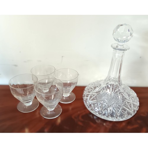 3 - A set of four 19th century glasses, together with a decanter, each with cut detail and faceted decor... 