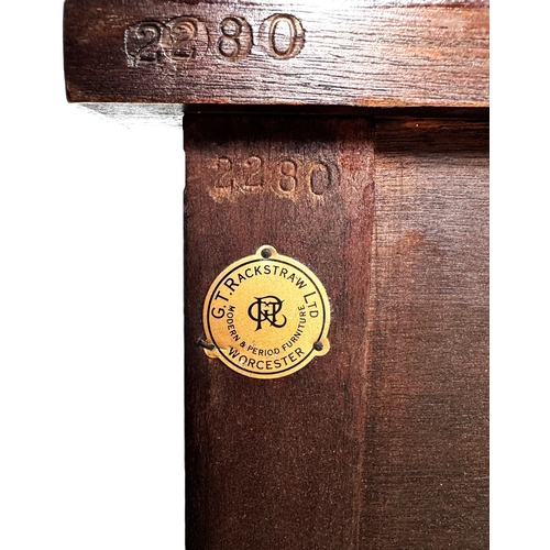 4 - A reproduction mahogany serpentine fronted sideboard, with shaped top above a series of drawers and ... 