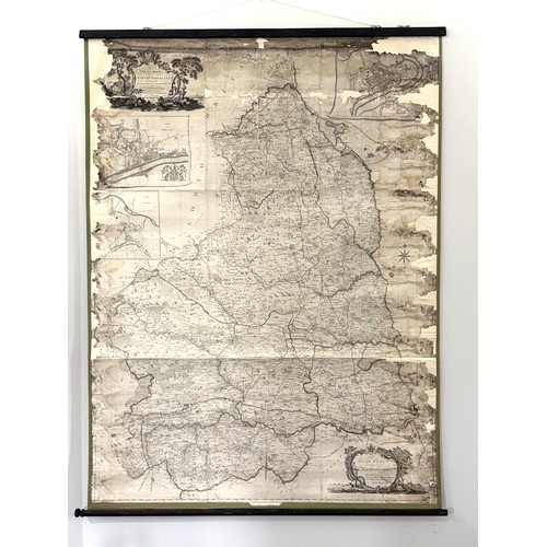7 - A large map of Northumberland, dated 1769, with detailed topographical engraving and place names, wi... 