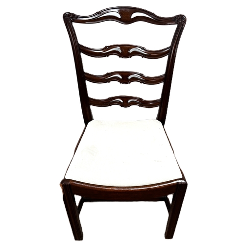 13 - A contemporary cantilever dining chair in faux leather upholstery; also a dining chair with cream fa... 