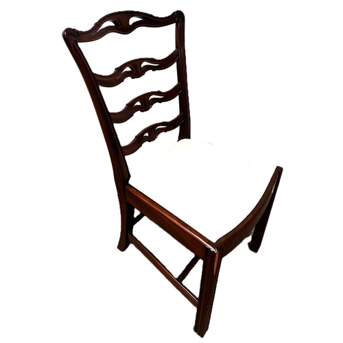 13 - A contemporary cantilever dining chair in faux leather upholstery; also a dining chair with cream fa... 