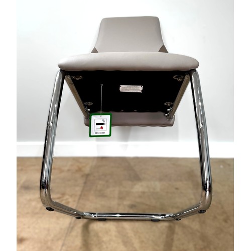 13 - A contemporary cantilever dining chair in faux leather upholstery; also a dining chair with cream fa... 