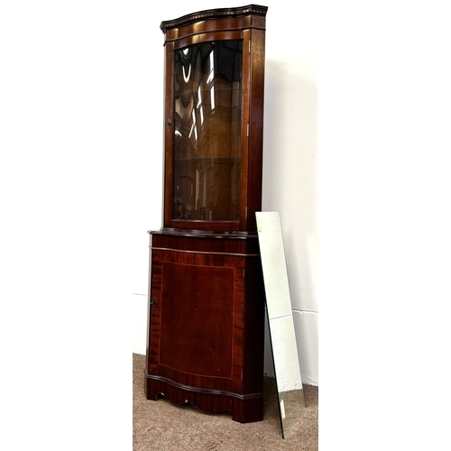 21 - A mahogany veneered George III reproduction corner cabinet; 179cm high, 65cm width, 44cm depth.