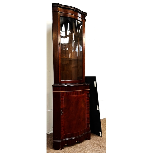 21 - A mahogany veneered George III reproduction corner cabinet; 179cm high, 65cm width, 44cm depth.
