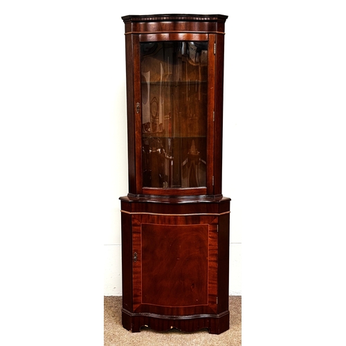 21 - A mahogany veneered George III reproduction corner cabinet; 179cm high, 65cm width, 44cm depth.