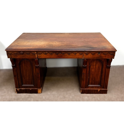 30 - A Victorian mahogany twin pedestal writing desk, circa 1840, with plain rectangular top, moulded apr... 