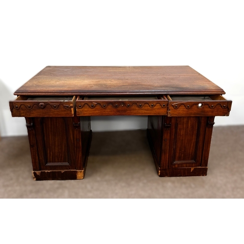 30 - A Victorian mahogany twin pedestal writing desk, circa 1840, with plain rectangular top, moulded apr... 
