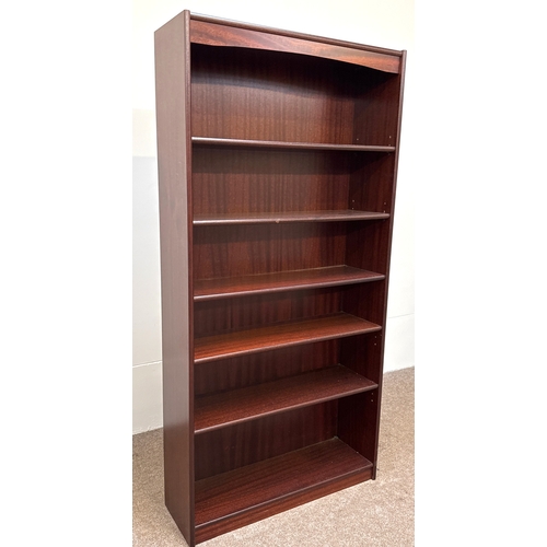 31 - A handy 'mahogany' varnished open bookcase with five fixed shelves; 181cm high, 90cm width, 28cm dep... 