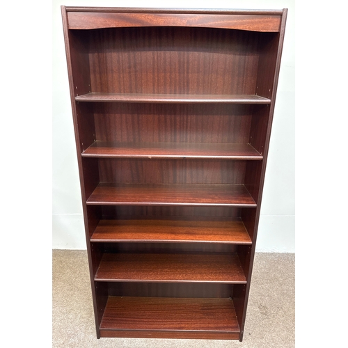 31 - A handy 'mahogany' varnished open bookcase with five fixed shelves; 181cm high, 90cm width, 28cm dep... 