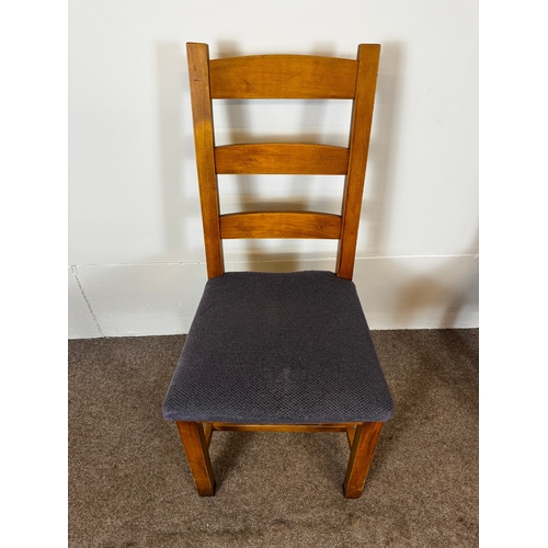 33 - Two modern café/ bar dining tables, together with seven ladder back chairs (9).