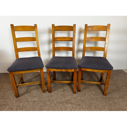 33 - Two modern café/ bar dining tables, together with seven ladder back chairs (9).