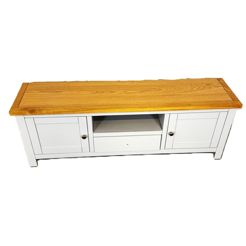 39 - A modern painted light grey television stand; 48cm high, 140cm width, 35cm depth.