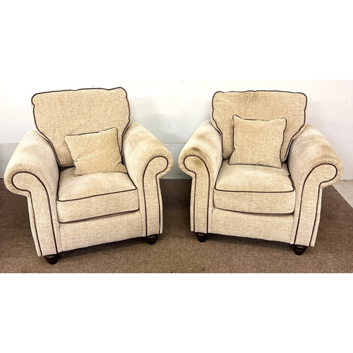 41 - A pair of modern deep and cushioned armchairs; 72cm high at frame/ 97cm high (inc cushion), 99cm wid... 