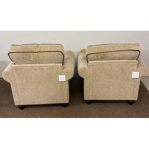 41 - A pair of modern deep and cushioned armchairs; 72cm high at frame/ 97cm high (inc cushion), 99cm wid... 