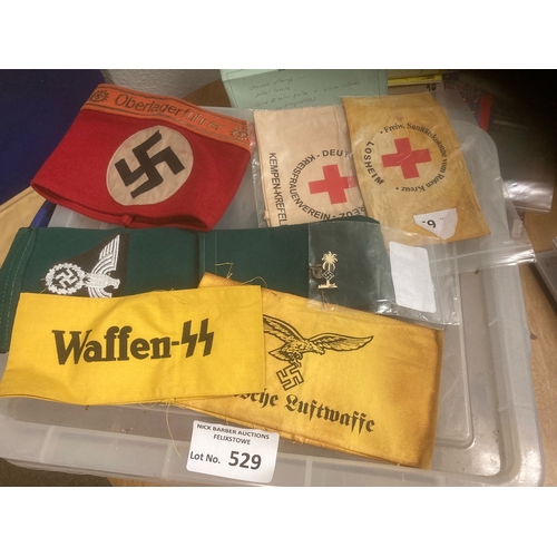 529 - Collectables : Militaria various WWII arm bands and a couple of German badges/pins