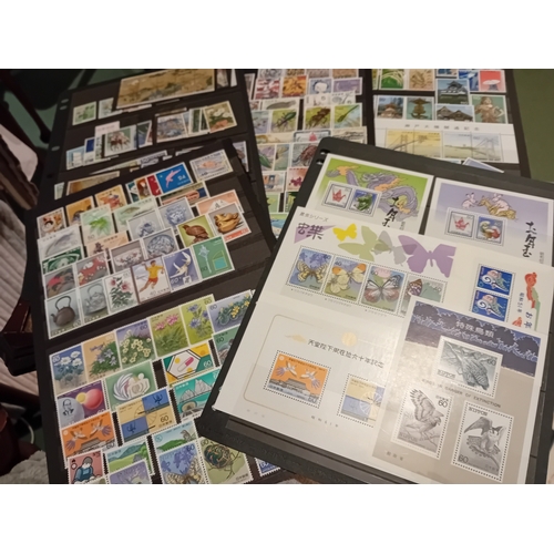 55 - Stamps : JAPAN  Two Stock books one has Defs  from c 1945 both M & U - the other Qty of  Commems & M... 