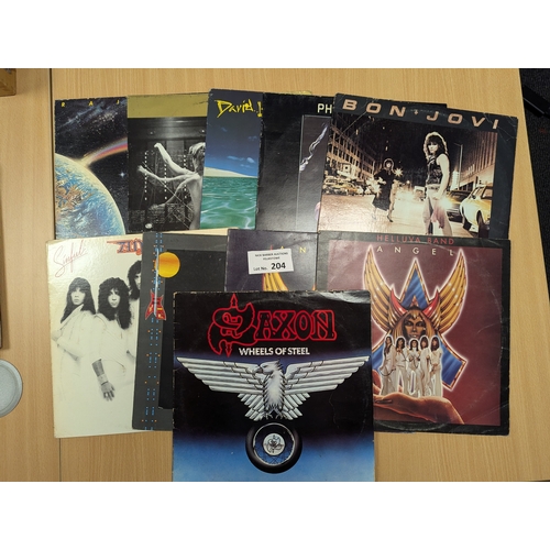 204 - Records: Assortment of Heavy Metal albums including Krokus, Saxon, etc.; conditions vary; (20).