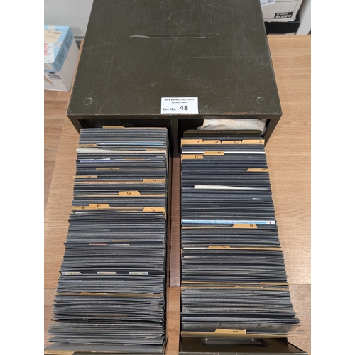 48 - Stamps: Metal drawers containing approx. 700 cards of world stamps; all periods; ordered alphabetica... 