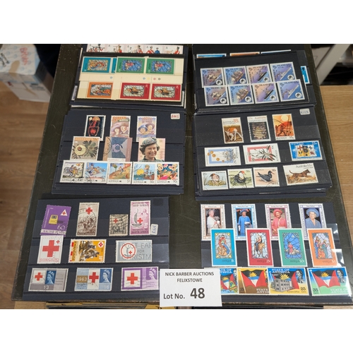 48 - Stamps: Metal drawers containing approx. 700 cards of world stamps; all periods; ordered alphabetica... 