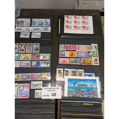 48 - Stamps: Metal drawers containing approx. 700 cards of world stamps; all periods; ordered alphabetica... 