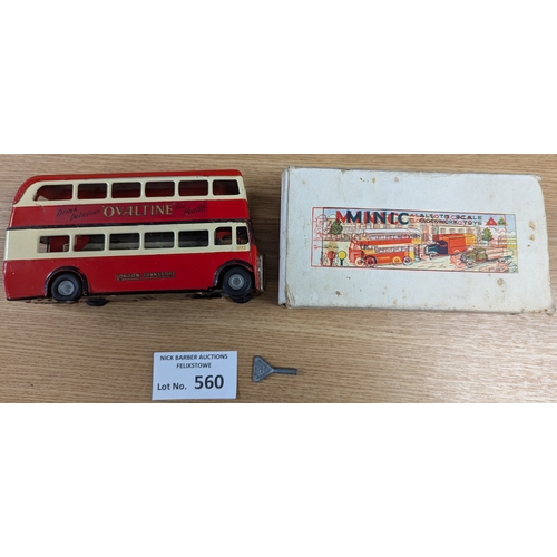 560 - Diecast: Tri-ang Minic pair, including D.D. Bus 'Ovaltine' (missing key, appears to not work); and D... 