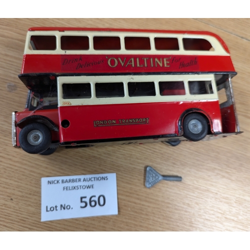 560 - Diecast: Tri-ang Minic pair, including D.D. Bus 'Ovaltine' (missing key, appears to not work); and D... 