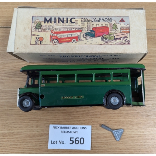 560 - Diecast: Tri-ang Minic pair, including D.D. Bus 'Ovaltine' (missing key, appears to not work); and D... 