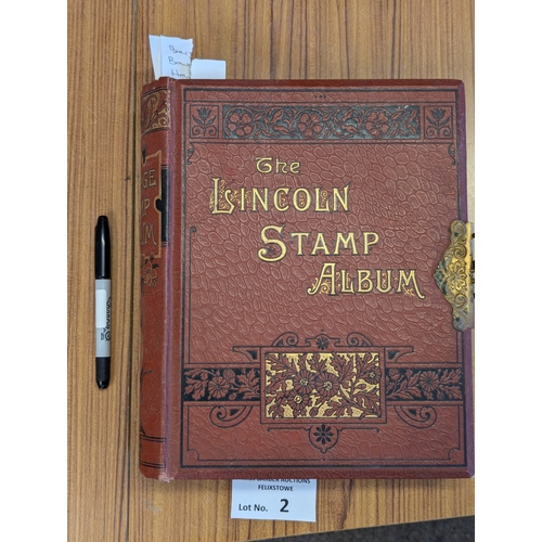 2 - Stamps: Lincoln album with metal clasp (pen for size comparison), slightly sparse.